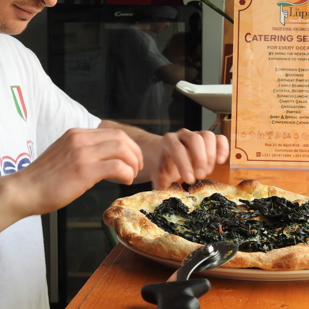 Truffle pizza being prepared at La Lupa